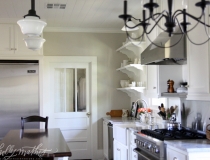 Updated farm kitchen with original door to laundry room